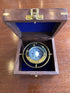 Brass compass in wooden box, fixed model