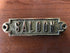 brass plate; SALOON